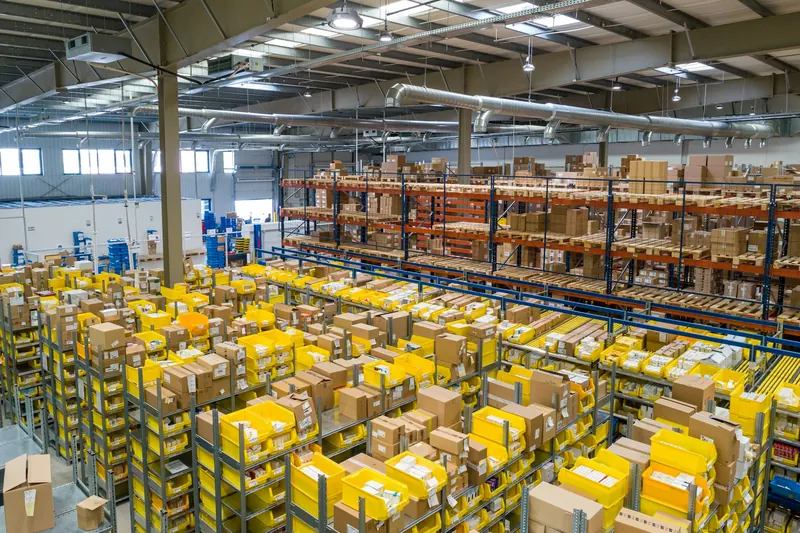 Warehouse aisle stacked with pallets and inventory