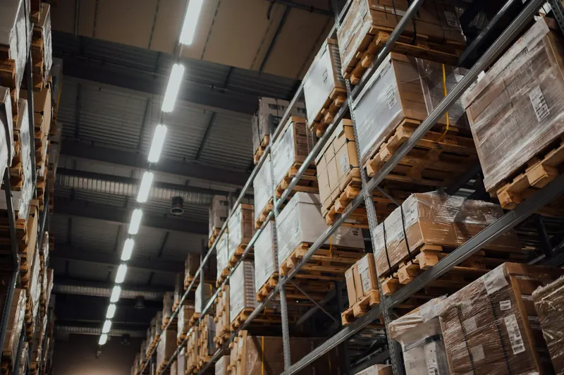 Warehouse racking stacked with pallets and boxes